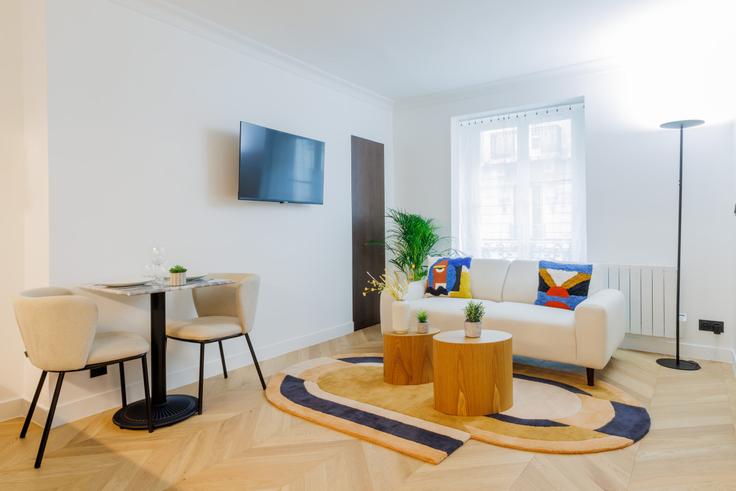Elegantly designed living room with modern furnishings in an apartment at Building Rue d'Amsterdam - evengestion - 1515276 in 8th arrondissement, Paris