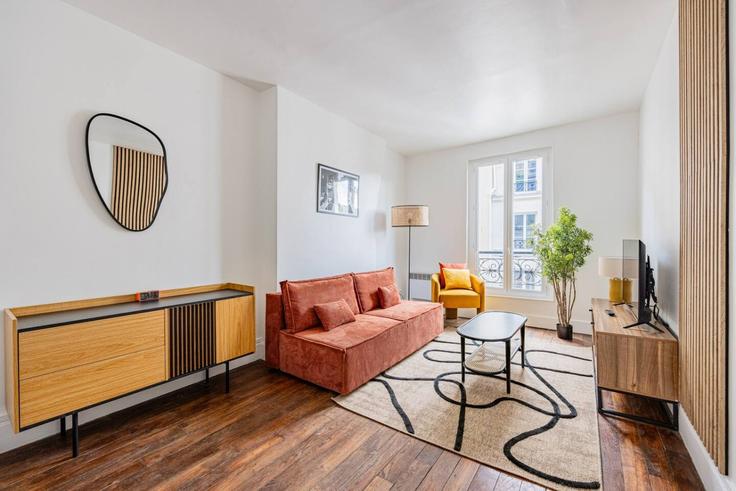Elegantly designed living room with modern furnishings in an apartment at Building Rue Neuve des Boulets - evengestion - 1563278 in 11th arrondissement, Paris Elegantly designed living room with modern furnishings in an apartment at Building Rue Neuve des Boulets - evengestion - 1563278 in 11th arrondissement, Paris