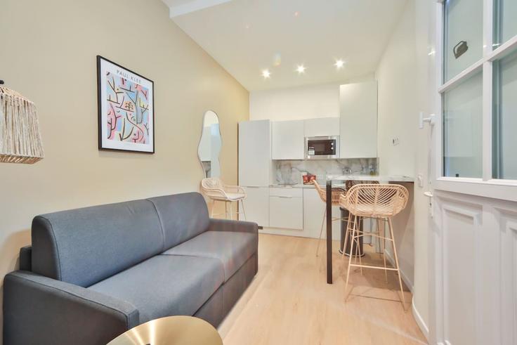 Sala de estar elegantemente projetada com móveis modernos em um apartamento no Building Place du Commerce - evengestion - 1575247 em 15th arrondissement, Paris Sala de estar elegantemente projetada com móveis modernos em um apartamento no Building Place du Commerce - evengestion - 1575247 em 15th arrondissement, Paris