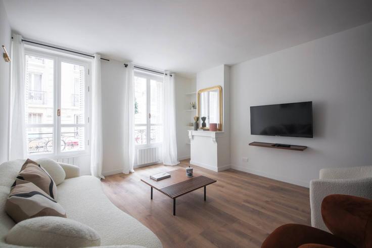 Salle de séjour élégante avec mobilier moderne dans un appartement à Building Place du Commerce - evengestion - 1583818 à 15th arrondissement, Paris Salle de séjour élégante avec mobilier moderne dans un appartement à Building Place du Commerce - evengestion - 1583818 à 15th arrondissement, Paris