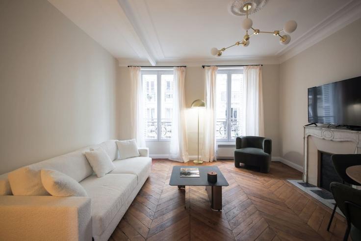 Salle de séjour élégante avec mobilier moderne dans un appartement à Building Place du Commerce - evengestion - 1584761 à 15th arrondissement, Paris Salle de séjour élégante avec mobilier moderne dans un appartement à Building Place du Commerce - evengestion - 1584761 à 15th arrondissement, Paris