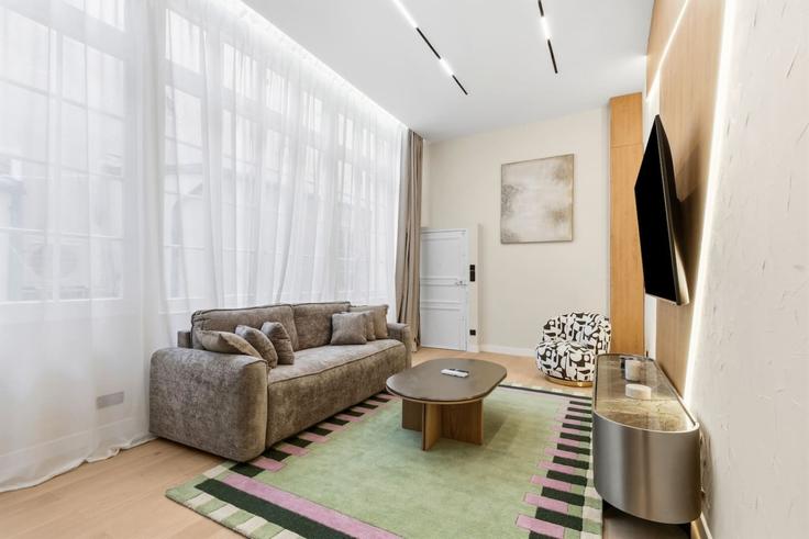 Elegantly designed living room with modern furnishings in an apartment at Building Rue de l'Ancienne Comédie - evengestion - 1696393 in 6th arrondissement, Paris Elegantly designed living room with modern furnishings in an apartment at Building Rue de l'Ancienne Comédie - evengestion - 1696393 in 6th arrondissement, Paris