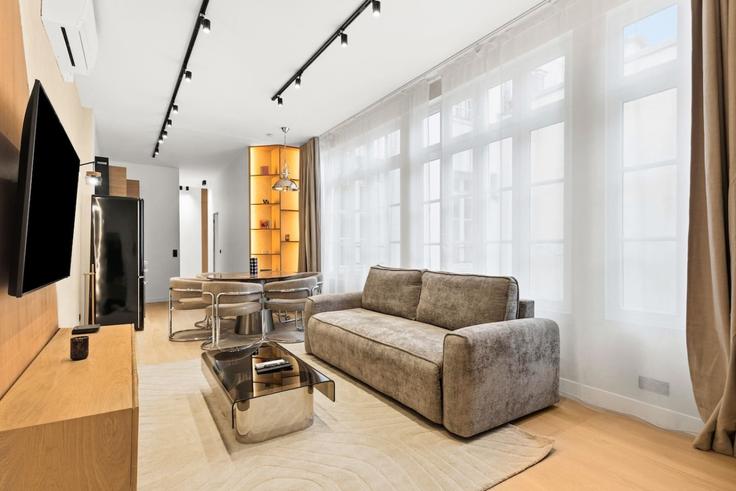 Elegantly designed living room with modern furnishings in an apartment at Building Rue de l'Ancienne Comédie - evengestion - 1696392 in 6th arrondissement, Paris Elegantly designed living room with modern furnishings in an apartment at Building Rue de l'Ancienne Comédie - evengestion - 1696392 in 6th arrondissement, Paris