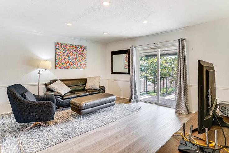 Elegantly designed living room with modern furnishings in an apartment at Building Regal Oaks Drive - evolve - 1386255 in Dallas, Dallas