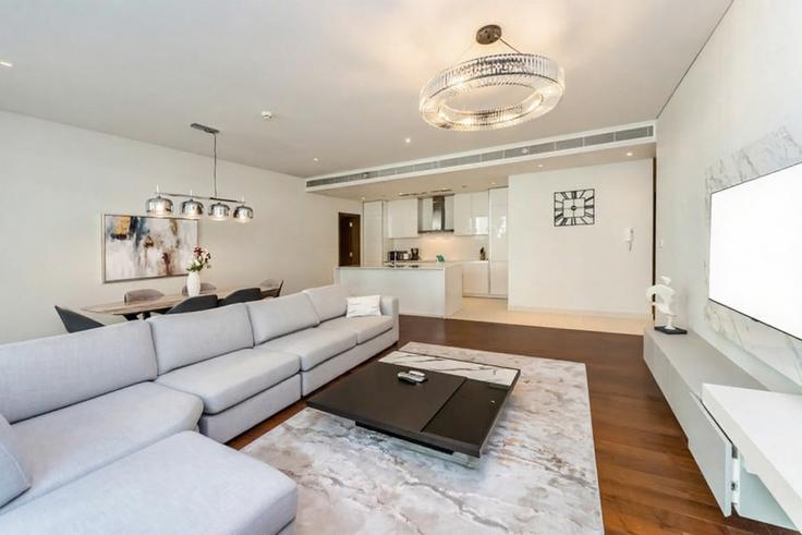 Elegantly designed living room with modern furnishings in an apartment at Building Al Raha St - fam-living - 1644517 in Al Wasl, Dubai