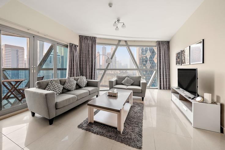 Elegantly designed living room with modern furnishings in an apartment at Building Tariaq Bedon Esm - first-class - 1336427 in Trade Center, Dubai Elegantly designed living room with modern furnishings in an apartment at Building Tariaq Bedon Esm - first-class - 1336427 in Trade Center, Dubai