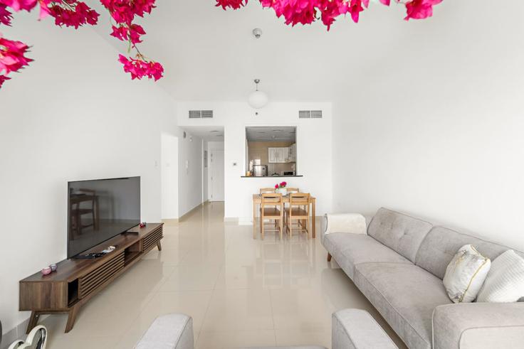 Elegantly designed living room with modern furnishings in an apartment at Building Tariaq Bedon Esm - first-class - 1336546 in JLT, Dubai Elegantly designed living room with modern furnishings in an apartment at Building Tariaq Bedon Esm - first-class - 1336546 in JLT, Dubai