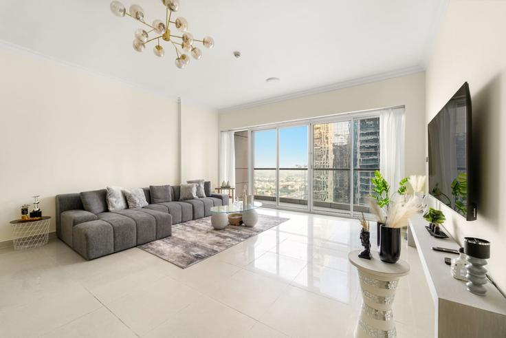 Elegantly designed living room with modern furnishings in an apartment at Building Cluster V - first-class - 1336625 in JLT, Dubai Elegantly designed living room with modern furnishings in an apartment at Building Cluster V - first-class - 1336625 in JLT, Dubai