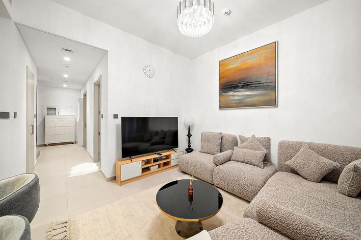 Elegantly designed living room with modern furnishings in an apartment at Building Emirates Road - first-class - 1369831 in Wadi Al Safa 5, Dubai