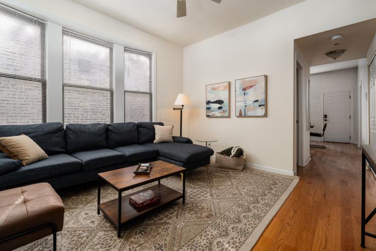 Elegantly designed living room with modern furnishings in an apartment at Building North Damen Avenue - flexhome - 1501223 in Chicago, Chicago