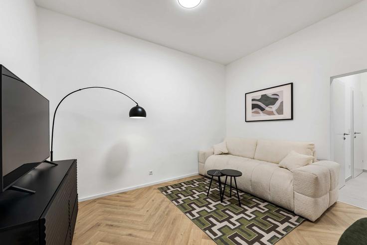 Salle de séjour élégante avec mobilier moderne dans un appartement à Building Jadengasse - flexi-flats-management-gmbh - 1613567 à Vienna, Vienna Salle de séjour élégante avec mobilier moderne dans un appartement à Building Jadengasse - flexi-flats-management-gmbh - 1613567 à Vienna, Vienna