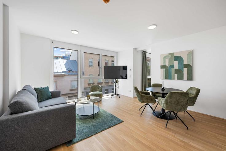 Sala de estar elegantemente projetada com móveis modernos em um apartamento no Building Siccardsburggasse - flexi-flats-management-gmbh - 1613544 em Vienna, Vienna Sala de estar elegantemente projetada com móveis modernos em um apartamento no Building Siccardsburggasse - flexi-flats-management-gmbh - 1613544 em Vienna, Vienna