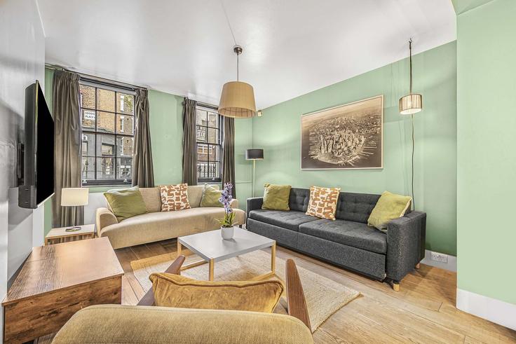 London City of WestminsterのBuilding Goodge Place - frankiesays - 1037695 - LONのアパートメントにある、モダンな家具を備えたエレガントなデザインのリビングルーム London City of WestminsterのBuilding Goodge Place - frankiesays - 1037695 - LONのアパートメントにある、モダンな家具を備えたエレガントなデザインのリビングルーム