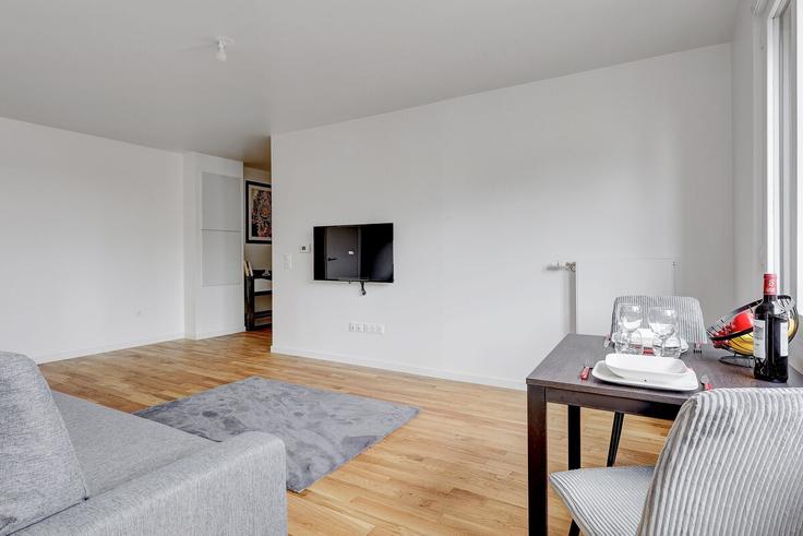 Elegante sala de estar con mobiliario moderno en un apartamento en Building Boulevard du Général d'Armée Jean Simon - full-concierge - 1285677 - PAR en 13th arrondissement, Paris Elegante sala de estar con mobiliario moderno en un apartamento en Building Boulevard du Général d'Armée Jean Simon - full-concierge - 1285677 - PAR en 13th arrondissement, Paris