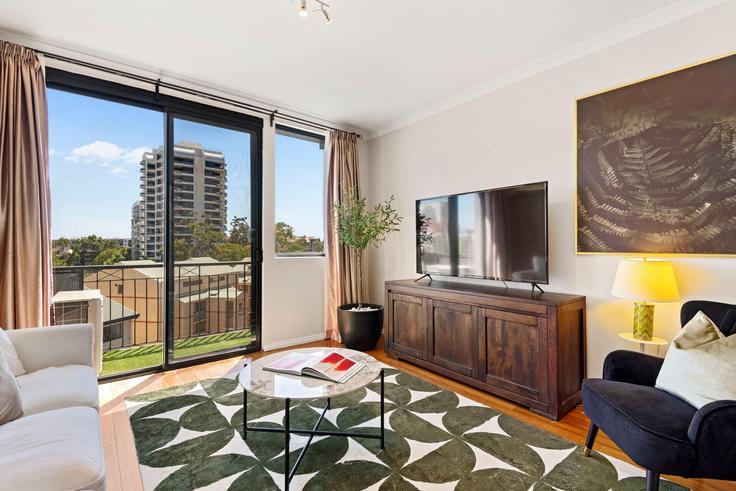 Elegante sala de estar con mobiliario moderno en un apartamento en Building Forrest Avenue - full-house-management - 1304260 - AUS en East Perth, Perth Elegante sala de estar con mobiliario moderno en un apartamento en Building Forrest Avenue - full-house-management - 1304260 - AUS en East Perth, Perth