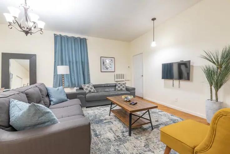 Elegantly designed living room with modern furnishings in an apartment at Building East 119th Street - furnishedhabitat - 1323986 in Manhattan, New York
