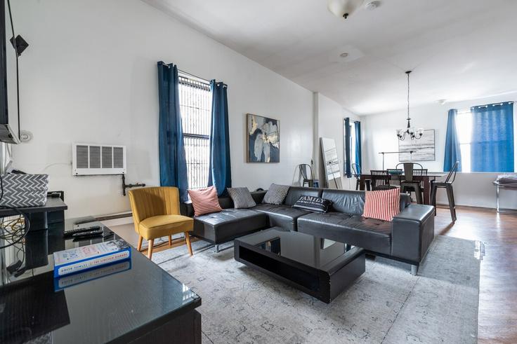 Elegantly designed living room with modern furnishings in an apartment at Building 1st Avenue - furnishedhabitat - 1325114 in Manhattan, New York