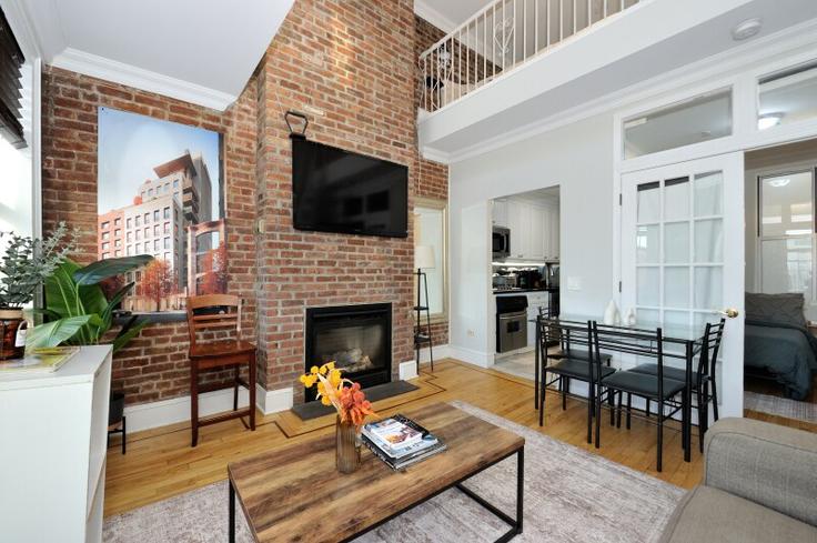 Elegantly designed living room with modern furnishings in an apartment at Building West 47th Street - furnishedhabitat - 1323964 in Manhattan, New York