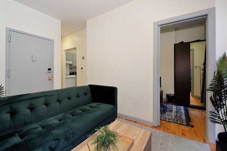 Elegantly designed living room with modern furnishings in an apartment at Building West 36th Street - furnishedhabitat - 1323943 in Manhattan, New York