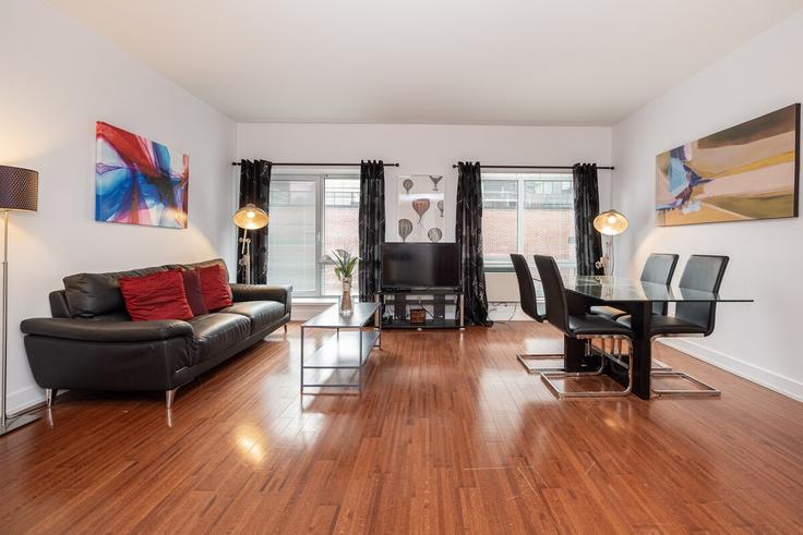 Salle de séjour élégante avec mobilier moderne dans un appartement à Building Rue De la Gauchetière Ouest - gesthab - 1261769 - TOR à Ville-Marie, Montreal