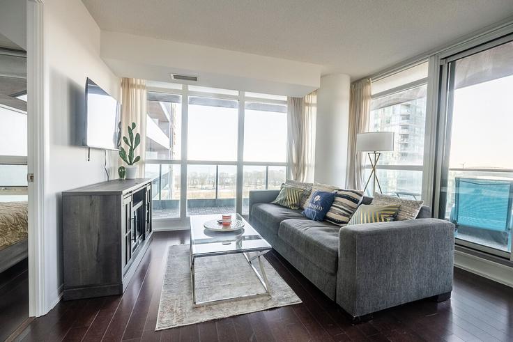 Elegantly designed living room with modern furnishings in an apartment at Building Fort York Boulevard - globalstayinc - 1397939 in Old Toronto, Toronto
