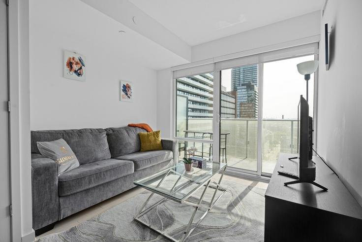 Elegant gestaltetes Wohnzimmer mit moderner Einrichtung in einer Wohnung im Building Yonge Street - globalstayinc - 1571680 in Old Toronto, Toronto Elegant gestaltetes Wohnzimmer mit moderner Einrichtung in einer Wohnung im Building Yonge Street - globalstayinc - 1571680 in Old Toronto, Toronto