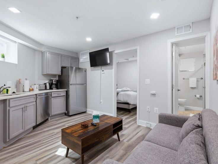 Elegantly designed living room with modern furnishings in an apartment at Building 7th Street Southeast - greatdwellings - 1592184 in Washington, Washington
