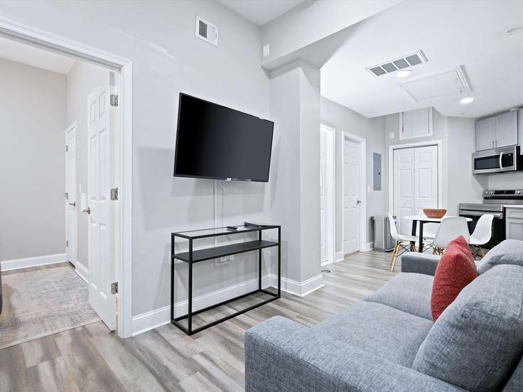 Elegantly designed living room with modern furnishings in an apartment at Building 7th Street Southeast - greatdwellings - 1596993 in Washington, Washington Elegantly designed living room with modern furnishings in an apartment at Building 7th Street Southeast - greatdwellings - 1596993 in Washington, Washington