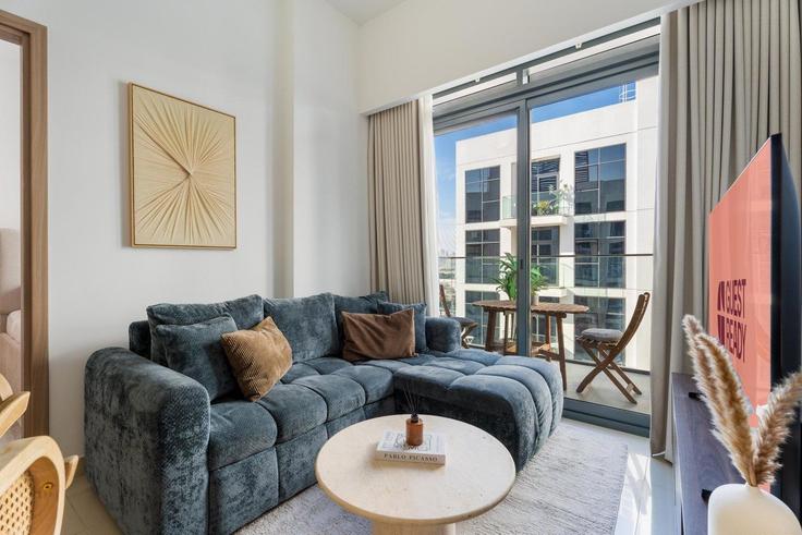 Elegantly designed living room with modern furnishings in an apartment at Building Tariaq Bedon Esm - guestready-dxb - 1497120 in Nad Al Sheba, Dubai