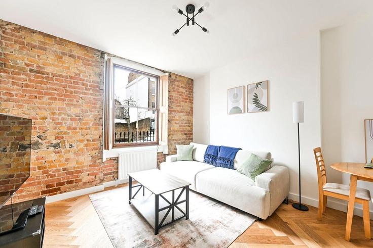 Elegante sala de estar con mobiliario moderno en un apartamento en Building Danbury Street - guestready-uk - 1495977 en London Borough of Islington, London Elegante sala de estar con mobiliario moderno en un apartamento en Building Danbury Street - guestready-uk - 1495977 en London Borough of Islington, London