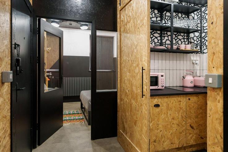 Cocina funcional y elegante con equipamiento de alta gama en un apartamento de lujo en Building Well Street - guestready-uk - 1334517 en London Borough of Hackney, London