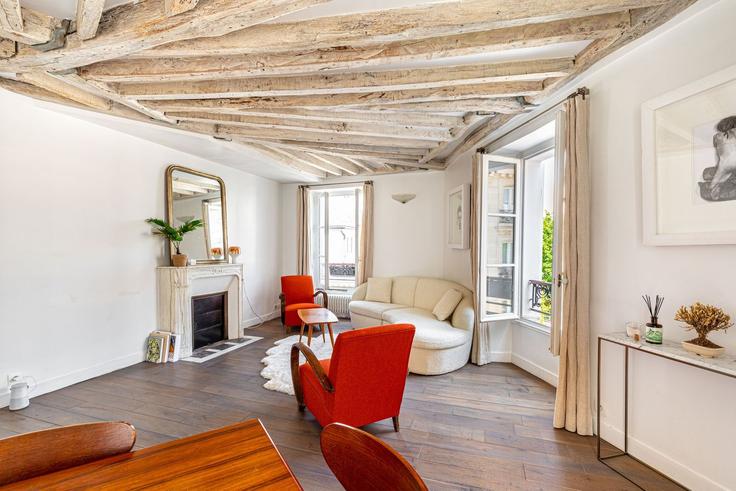 Elegante sala de estar con mobiliario moderno en un apartamento en Building 1 Rue Frochot, Paris, France - guestready - 1599036 en 9th arrondissement, Paris
