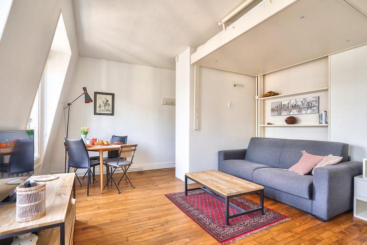 Salle de séjour élégante avec mobilier moderne dans un appartement à Building Rue Marguerite Boucicaut - guestready - 1229023 - PAR à 15th arrondissement, Paris