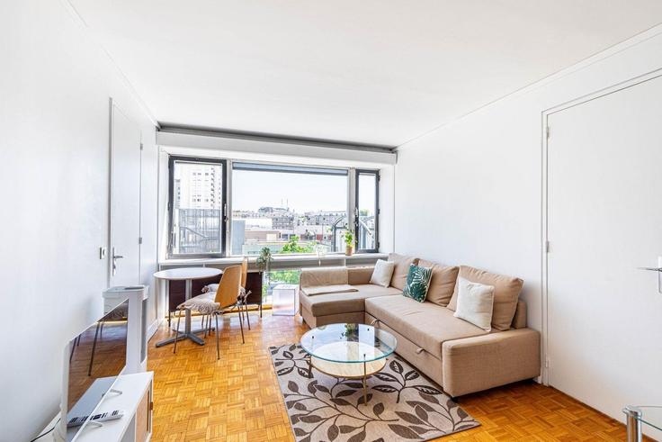 Elegantly designed living room with modern furnishings in an apartment at Building Rue du Commandant René Mouchotte - guestready - 1303669 - PAR in 14th arrondissement, Paris Elegantly designed living room with modern furnishings in an apartment at Building Rue du Commandant René Mouchotte - guestready - 1303669 - PAR in 14th arrondissement, Paris