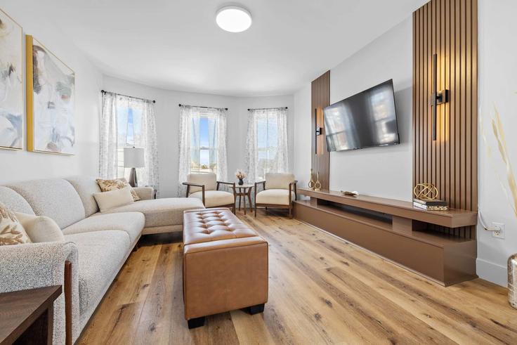 Elegantly designed living room with modern furnishings in an apartment at Building Hillsborough Street - hennessey-properties - 1699047 in Charlottetown, Charlottetown