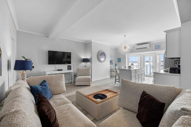 Elegantly designed living room with modern furnishings in an apartment at Building Water Street - hennessey-properties - 1699042 in Charlottetown, Charlottetown
