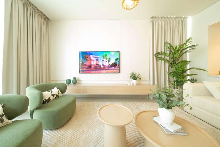 Elegant gestaltetes Wohnzimmer mit moderner Einrichtung in einer Wohnung im Building Abu Baker Al Siddique St - hive-holiday-homes-1 - 1699656 in Hamriya West, Al Hamriyah