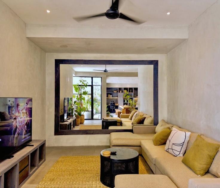 Elegante sala de estar con mobiliario moderno en un apartamento en Building Gang Jalak - hive-holiday-homes-1 - 1649296 en Kuta Utara, Badung Regency Elegante sala de estar con mobiliario moderno en un apartamento en Building Gang Jalak - hive-holiday-homes-1 - 1649296 en Kuta Utara, Badung Regency