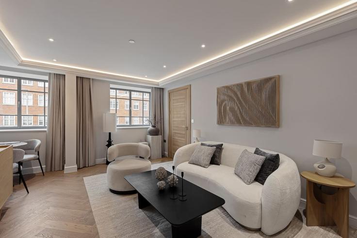 Elegant gestaltetes Wohnzimmer mit moderner Einrichtung in einer Wohnung im Building Kensington High Street - hive-stays-ltd - 1504188 in Royal Borough of Kensington and Chelsea, London Elegant gestaltetes Wohnzimmer mit moderner Einrichtung in einer Wohnung im Building Kensington High Street - hive-stays-ltd - 1504188 in Royal Borough of Kensington and Chelsea, London