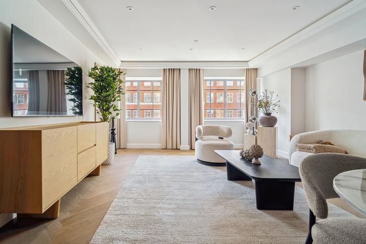 Elegante sala de estar con mobiliario moderno en un apartamento en Building Kensington High Street - hive-stays-ltd - 1512997 en Royal Borough of Kensington and Chelsea, London