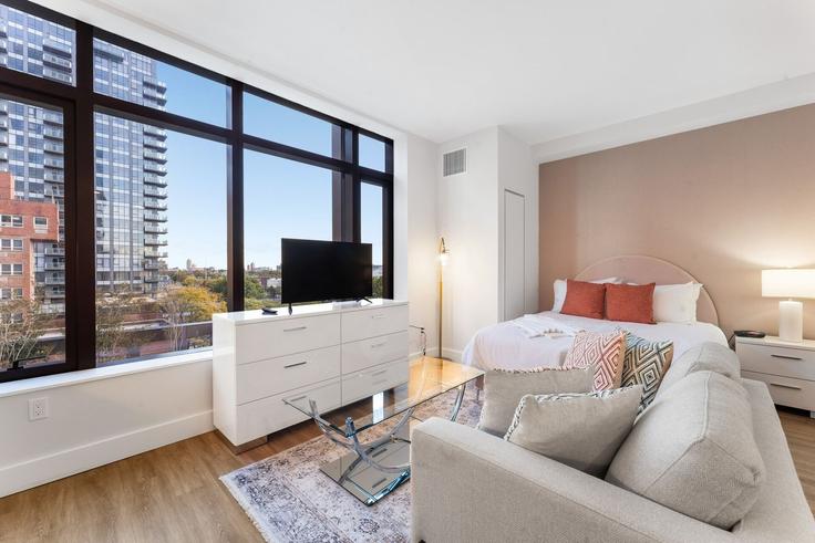 Elegantly designed living room with modern furnishings in an apartment at Building Cropsey Avenue - home-to-host-usa - 1466791 in Brooklyn, New York