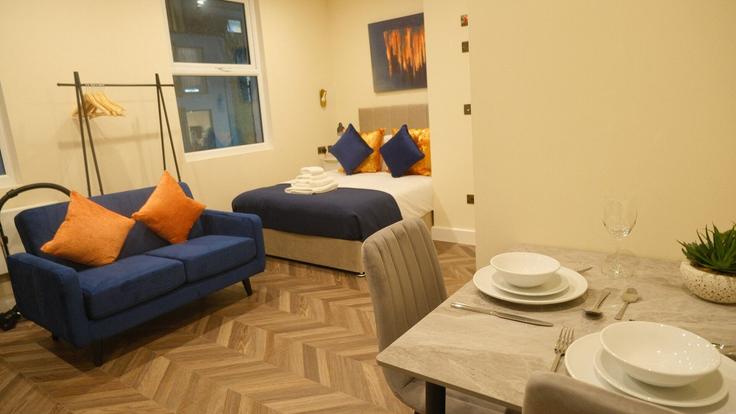 Elegantly designed living room with modern furnishings in an apartment at Building 399 North End Road - home-to-host-usa - 1476009 in London Borough of Hammersmith and Fulham, London