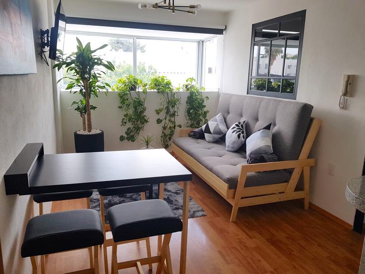 Sala de estar elegantemente projetada com móveis modernos em um apartamento no Building Avenida Nuevo León - hostair - 1582653 em Mexico City, Mexico City Sala de estar elegantemente projetada com móveis modernos em um apartamento no Building Avenida Nuevo León - hostair - 1582653 em Mexico City, Mexico City