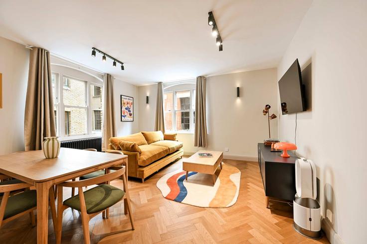 Salle de séjour élégante avec mobilier moderne dans un appartement à Building Langley Court - hostedbysleepover - 1610182 à City of Westminster, London Salle de séjour élégante avec mobilier moderne dans un appartement à Building Langley Court - hostedbysleepover - 1610182 à City of Westminster, London