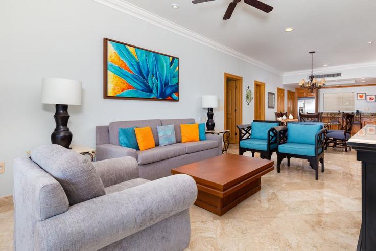 Elegante sala de estar con mobiliario moderno en un apartamento en Building Paseo de los Cocoteros - hosteeva - 1632753 en Flamingos, Flamingos