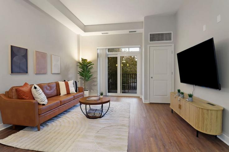 Elegante sala de estar con mobiliario moderno en un apartamento en Building North Addison Avenue - house-of-living21 - 1366992 en Elmhurst, Elmhurst