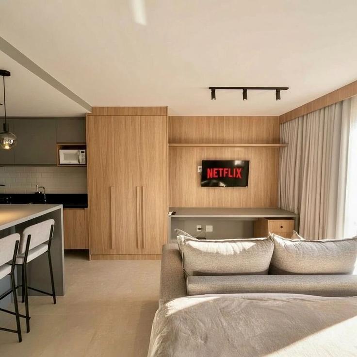 Sala de estar elegantemente projetada com móveis modernos em um apartamento no Building Rua Dukla de Aguiar - housi-servicos-digitais-sa - 1604616 em Santa Helena, Vitória