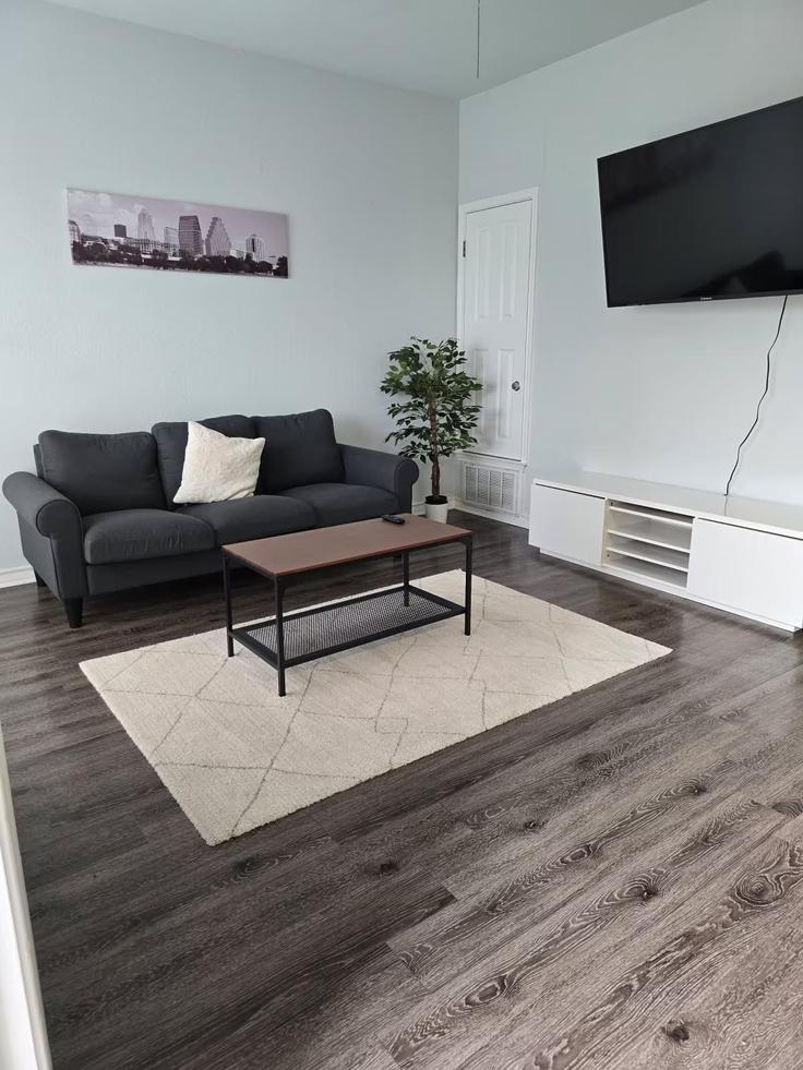 Elegantly designed living room with modern furnishings in an apartment at Building West 22nd Street - housingpanda - 1318670 in Austin, Austin
