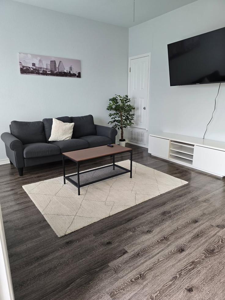Elegantly designed living room with modern furnishings in an apartment at Building West 23rd Street - housingpanda - 1318655 in Austin, Austin