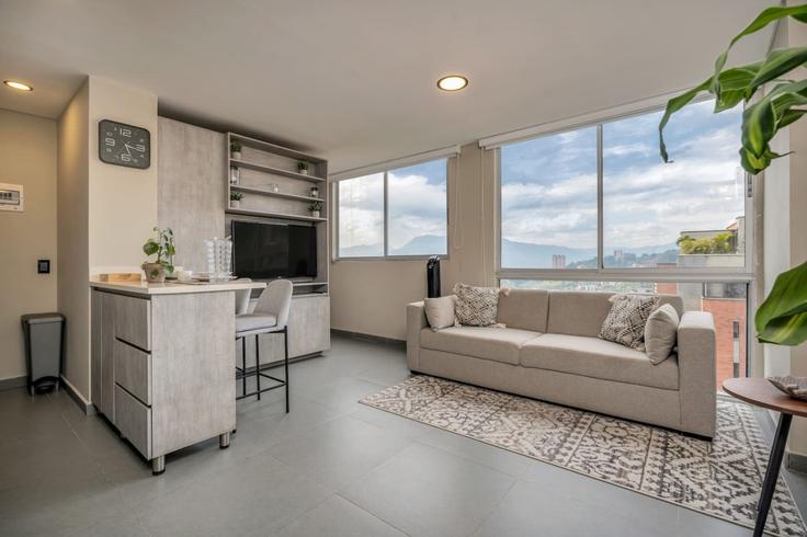 Salle de séjour élégante avec mobilier moderne dans un appartement à Building Carrera 29 - housy-host - 1327018 à El Poblado, Medellín
